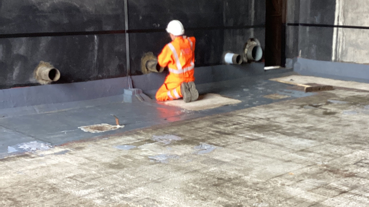 Applying Polyurea Coating to Line a Concrete Bund in Preparation for ...